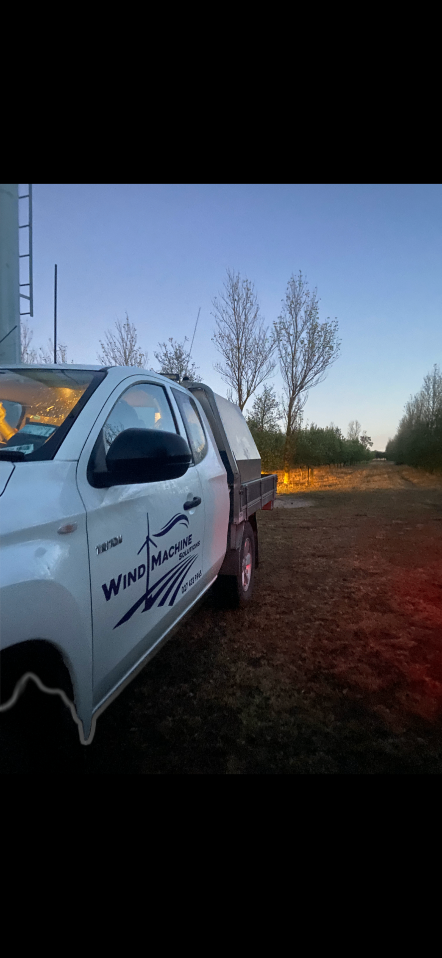 Wind Machine Solutions branded ute on site at a New Zealand vineyard